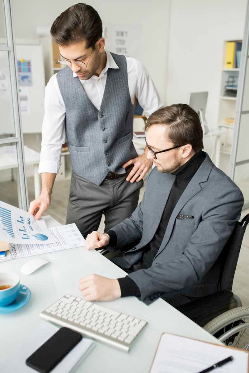 business-people-examining-business-graphs-EYB89TR.jpg